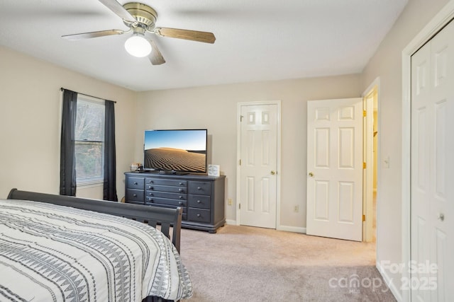 bedroom featuring ceiling fan and light colored carpet