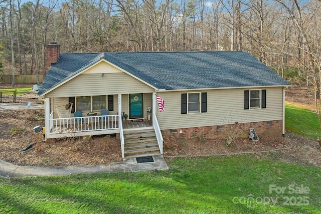 view of front of property with a front yard and covered porch