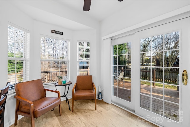 sunroom / solarium with ceiling fan