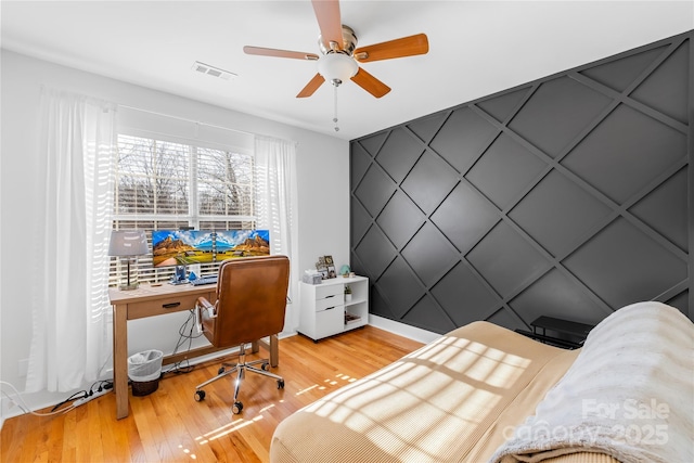 bedroom with ceiling fan and light wood-type flooring