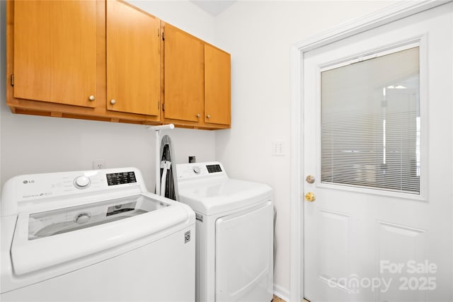 washroom with cabinets and separate washer and dryer