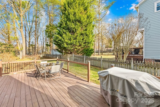 wooden deck with grilling area