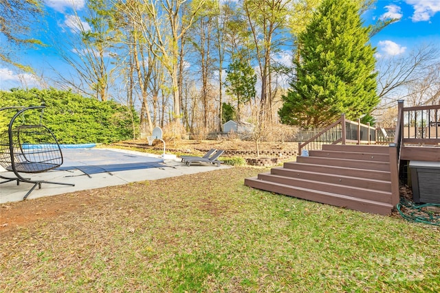 view of yard featuring a patio and a pool side deck