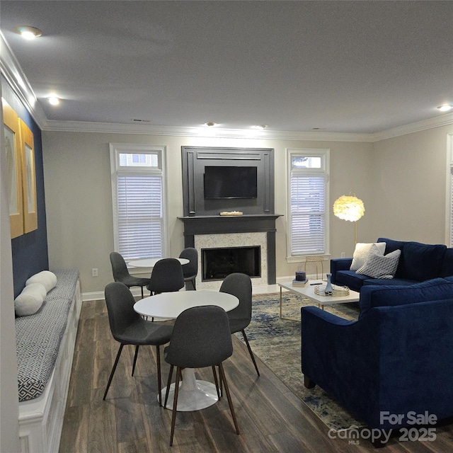 living room featuring ornamental molding and dark wood-type flooring