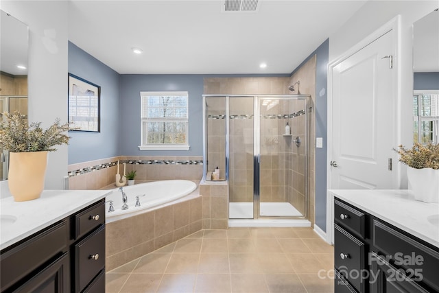 bathroom with vanity, plus walk in shower, and tile patterned flooring