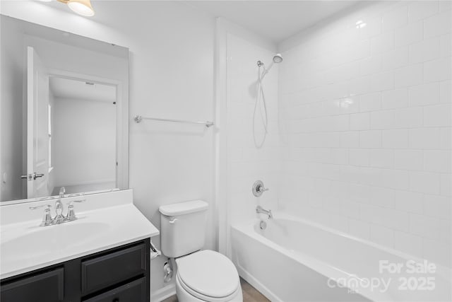 full bathroom featuring vanity, toilet, and tiled shower / bath combo