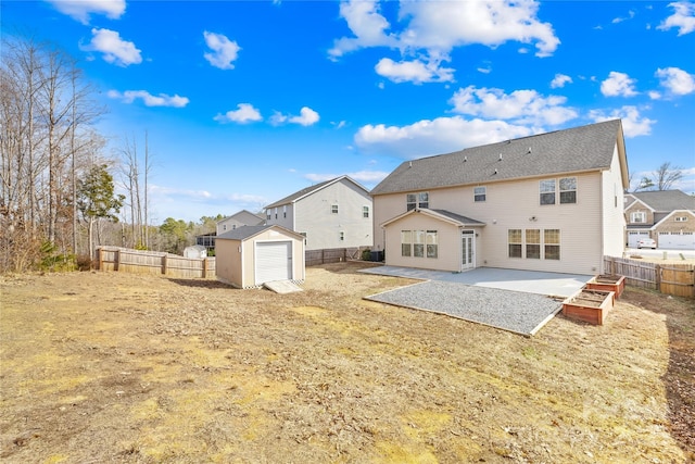 rear view of property with a patio area and a storage unit