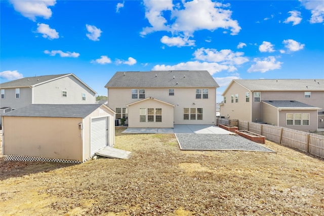 rear view of house featuring a yard, a shed, and a patio area