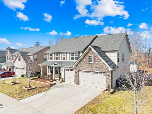 view of front facade featuring a garage, a front lawn, and a porch