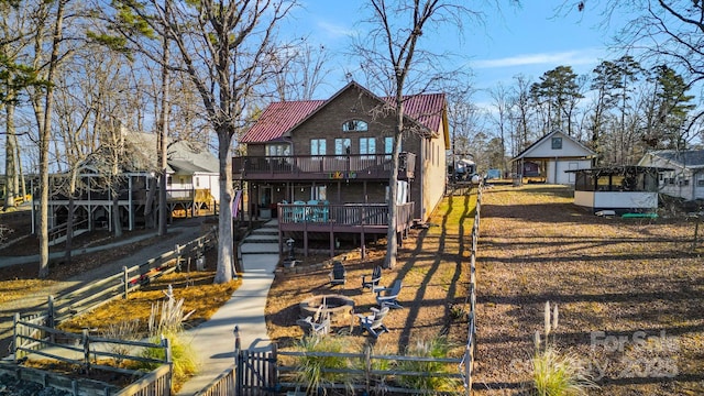 back of property featuring a balcony