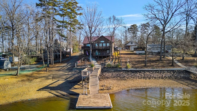 back of property with a water view