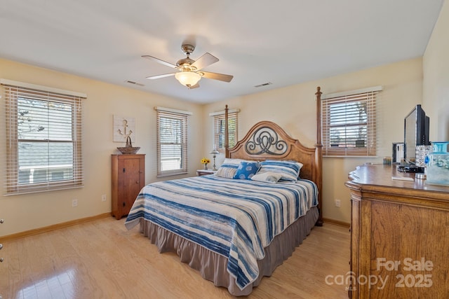 bedroom with ceiling fan and light hardwood / wood-style flooring