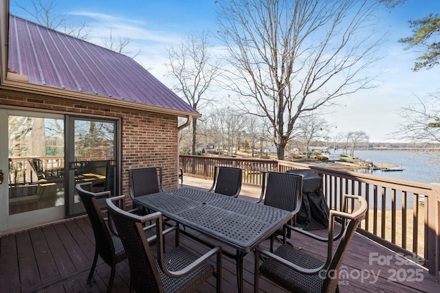 wooden deck featuring a water view