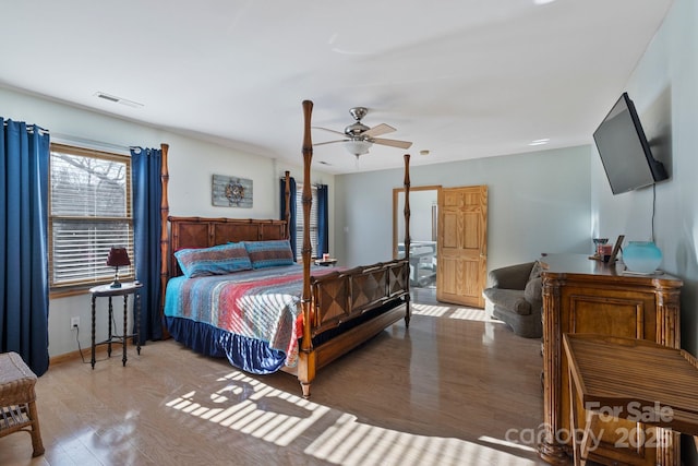 bedroom featuring wood-type flooring and ceiling fan