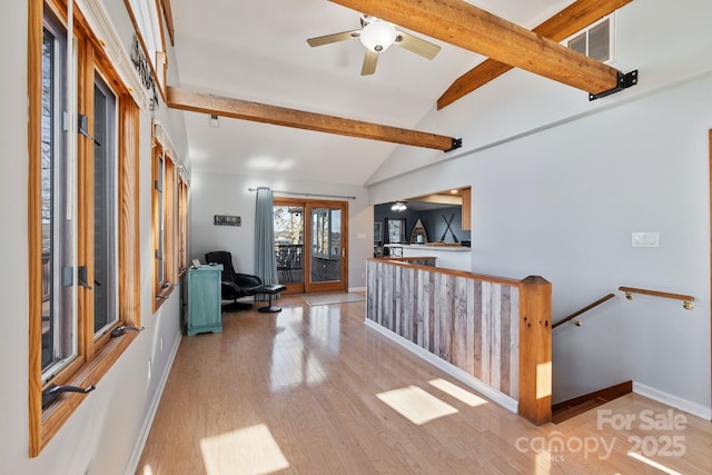 corridor featuring lofted ceiling with beams and light hardwood / wood-style flooring