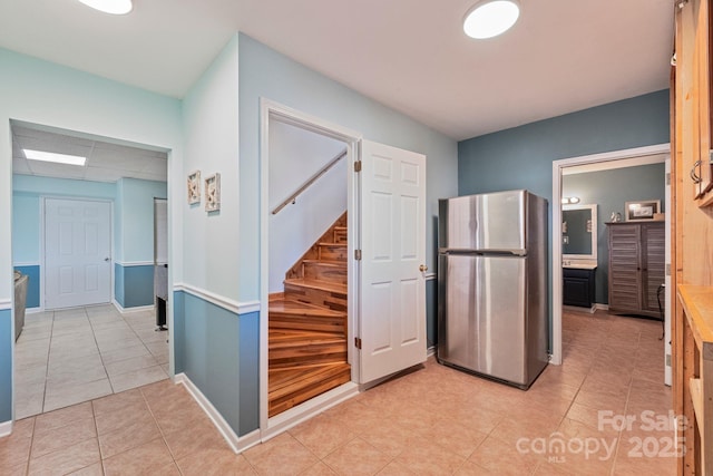 hallway with light tile patterned flooring