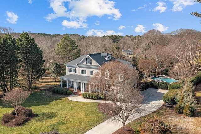 view of front of property with a porch and a front yard