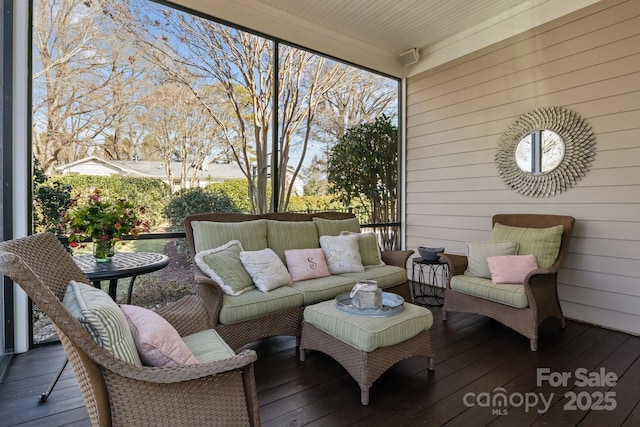 wooden terrace with an outdoor hangout area