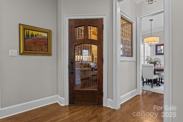 interior space featuring hardwood / wood-style floors and a chandelier