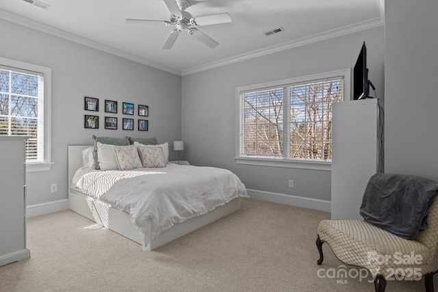 bedroom featuring ornamental molding, light carpet, and ceiling fan