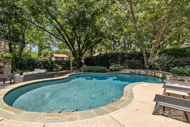 110 Lynbrook Dr, Davidson, NC 28036 - view of swimming pool featuring a patio area and an outdoor stone fireplace