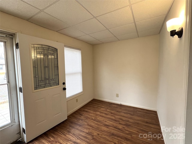 entryway with a drop ceiling and dark hardwood / wood-style flooring