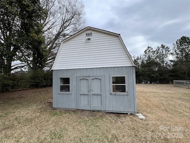 view of outbuilding with a lawn