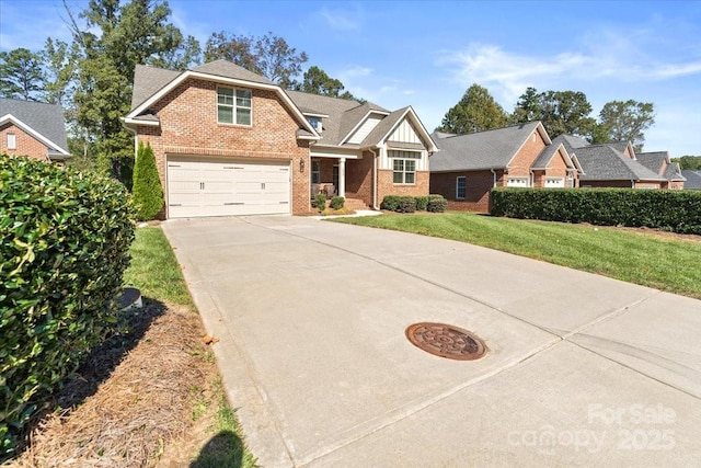 view of front of house featuring a garage and a front lawn