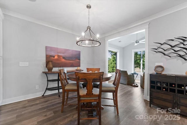 dining area with crown molding, ceiling fan, lofted ceiling, and dark wood-type flooring