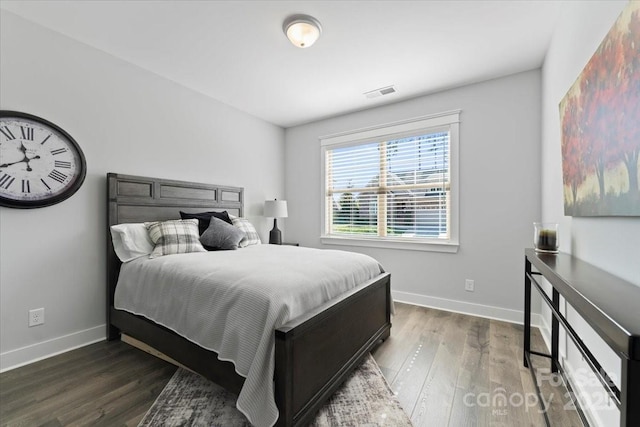 bedroom featuring dark hardwood / wood-style flooring