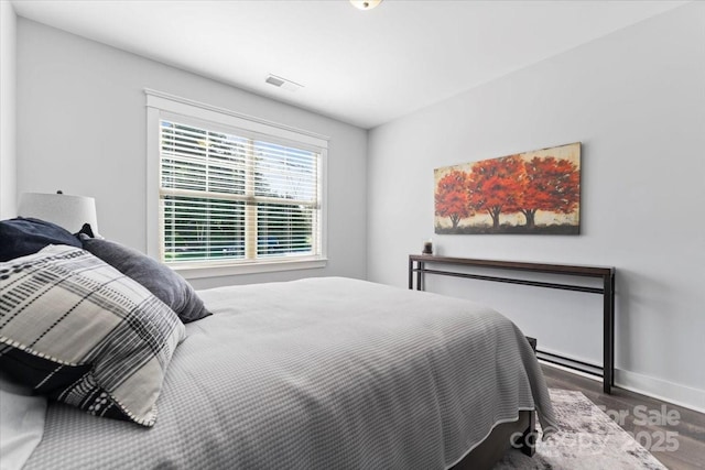 bedroom featuring dark hardwood / wood-style flooring