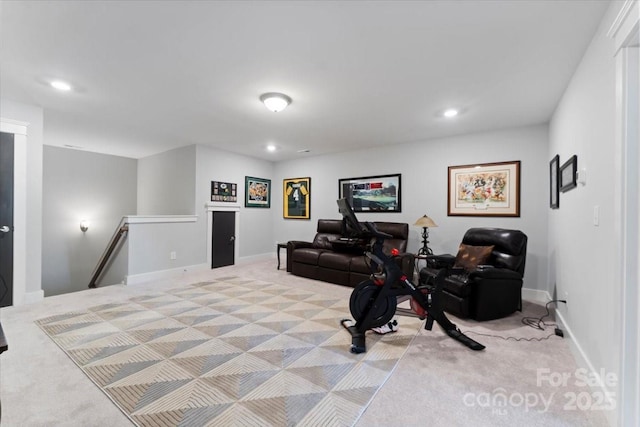 workout room featuring light carpet