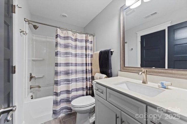 full bathroom featuring shower / bath combination with curtain, vanity, and toilet