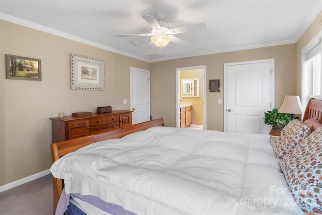carpeted bedroom featuring ceiling fan, crown molding, baseboards, and ensuite bathroom