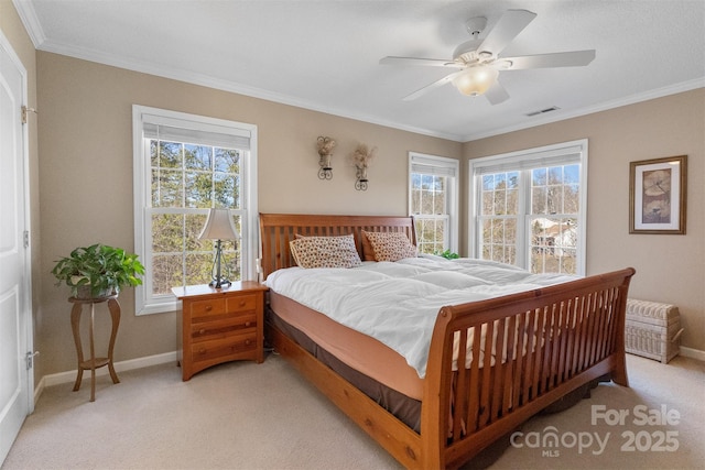 bedroom featuring ornamental molding, light carpet, visible vents, and baseboards