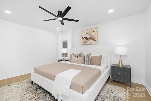 bedroom featuring hardwood / wood-style floors and ceiling fan