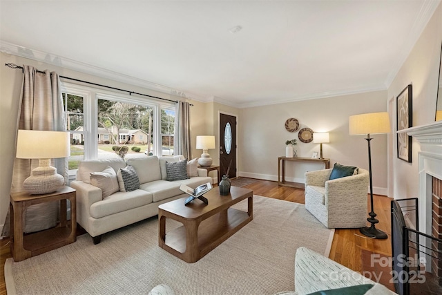 living room featuring ornamental molding and light hardwood / wood-style floors