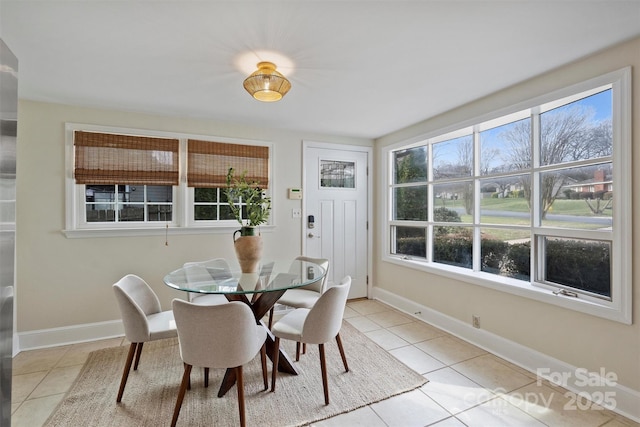 dining space with light tile patterned flooring