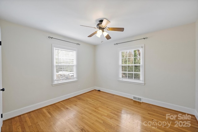 spare room with light hardwood / wood-style floors and ceiling fan