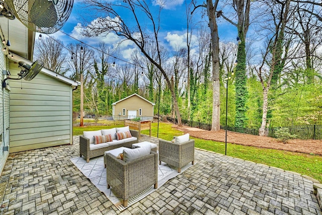 view of patio / terrace featuring an outbuilding and outdoor lounge area