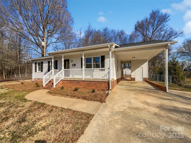 single story home with a carport and covered porch