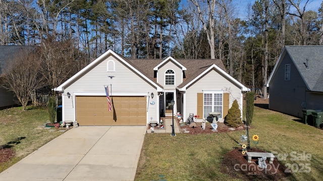 view of front of property featuring a garage and a front yard