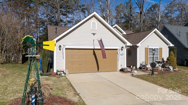 view of front of property featuring a garage and a front lawn