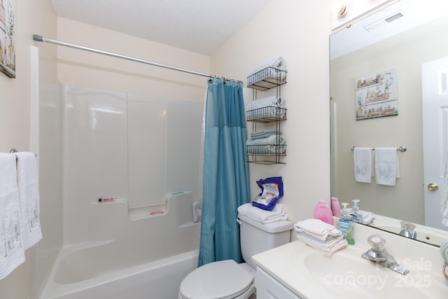 full bathroom featuring vanity, shower / bath combo, toilet, and a textured ceiling