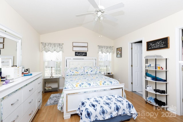 bedroom featuring vaulted ceiling and light hardwood / wood-style flooring