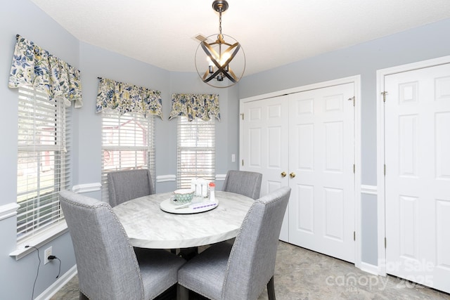 dining space with a chandelier