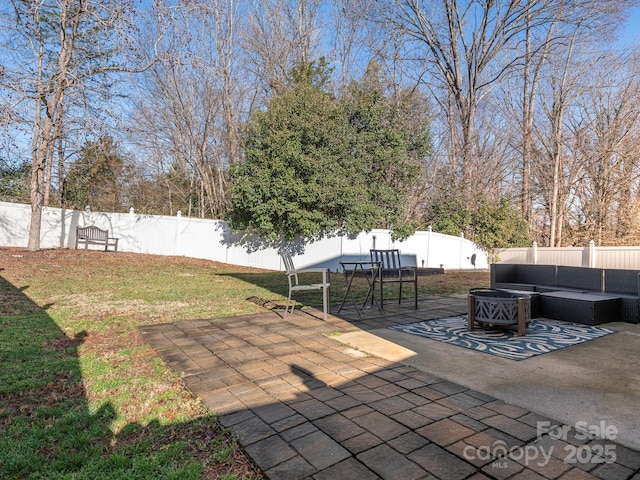 view of patio / terrace with an outdoor living space with a fire pit