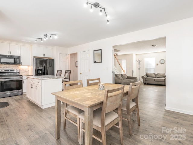 dining room with light hardwood / wood-style flooring