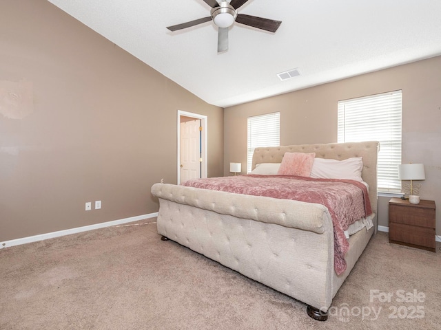 bedroom featuring ceiling fan, lofted ceiling, light carpet, and multiple windows