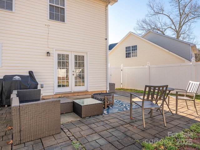 view of patio / terrace featuring french doors, area for grilling, and outdoor lounge area